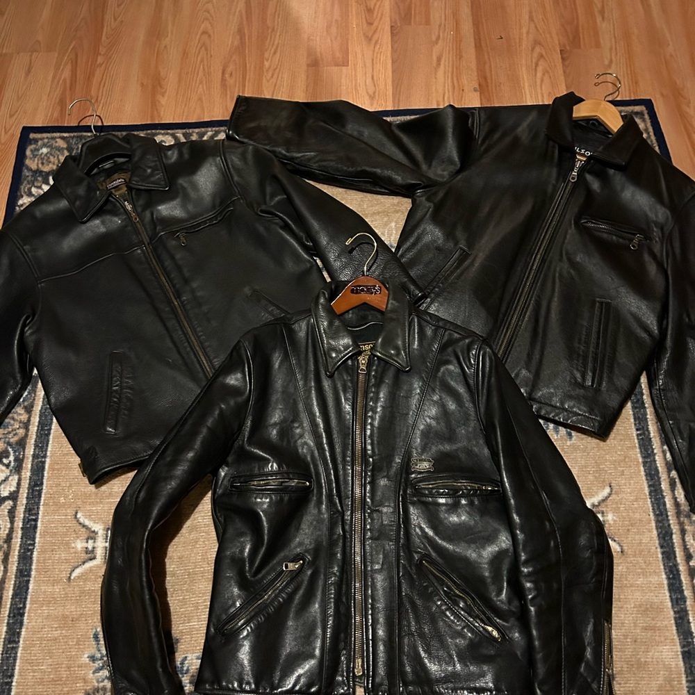 There are 3 Wilson’s Leather Jackets 2 black 1 brown and 1 Vansom Biker Leather